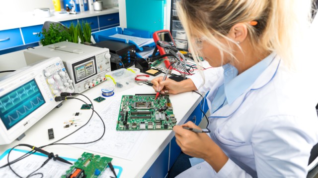 Woman using electronic equipment