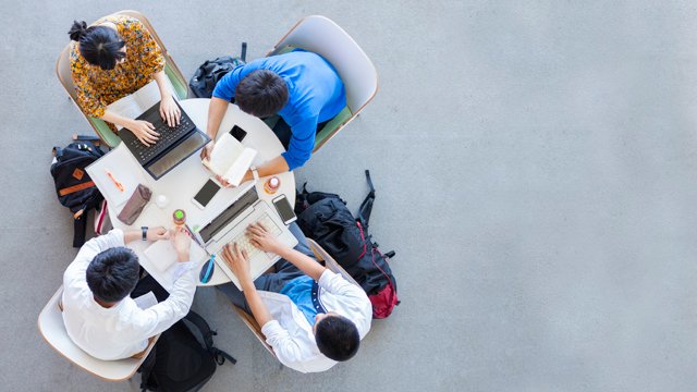 Birdseye view of students sitting around table