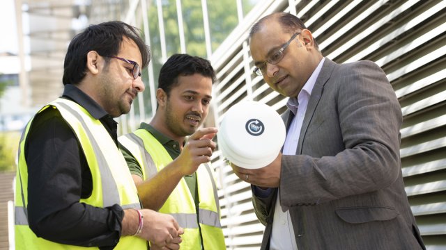 Prashant and two people experimenting with clean air equipment