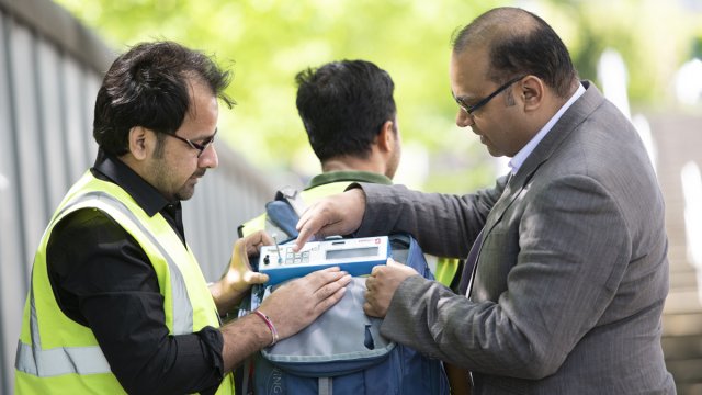 Prashant and two people experimenting with clean air equipment