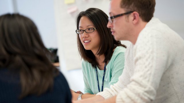 PhD students in discussion