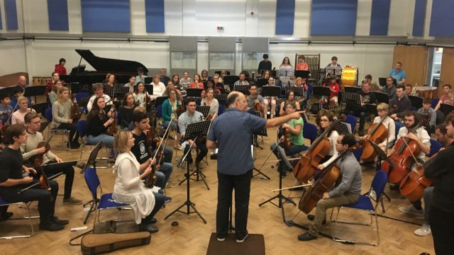 Richard Keable gives some last minute direction to the orchestra