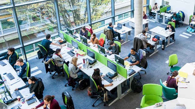 Students in the library on computers