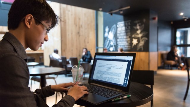A man in Starbucks on his laptop