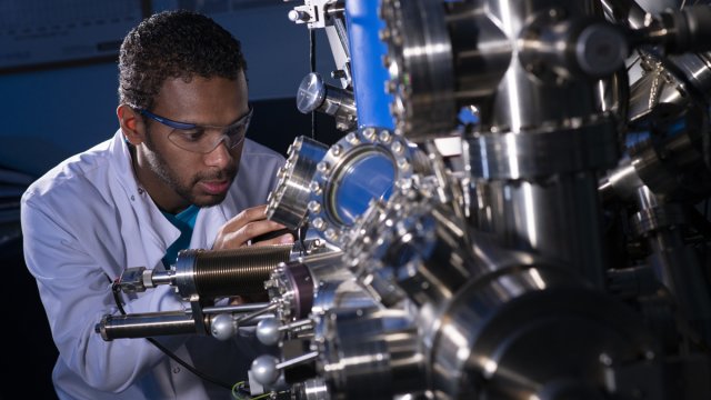 Student using mechanical engineering equipment