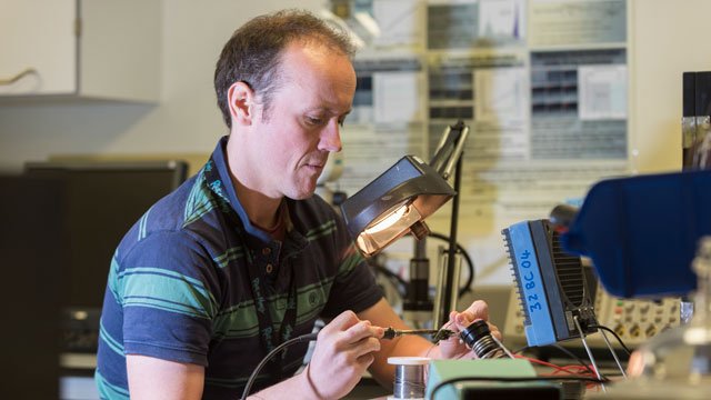 Man using physics equipment