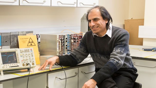 Staff member sitting in a lab