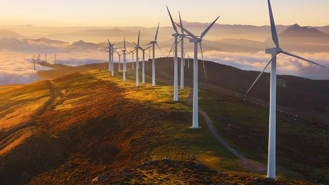 Wind turbines on a hill in the countryside