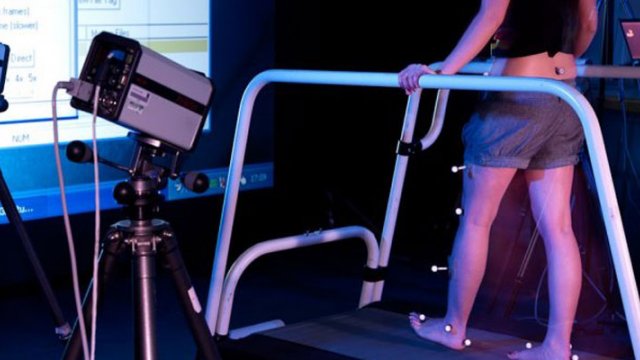 Student walking on treadmill in the Human Movement Laboratory
