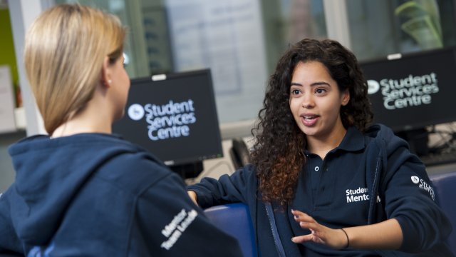 Student speaking with a Student mentor