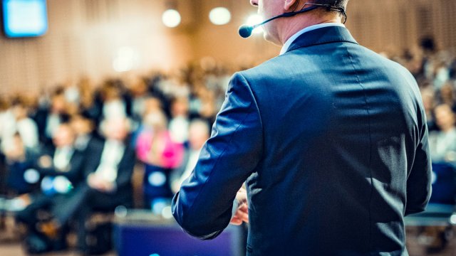 Person speaking to a crowd