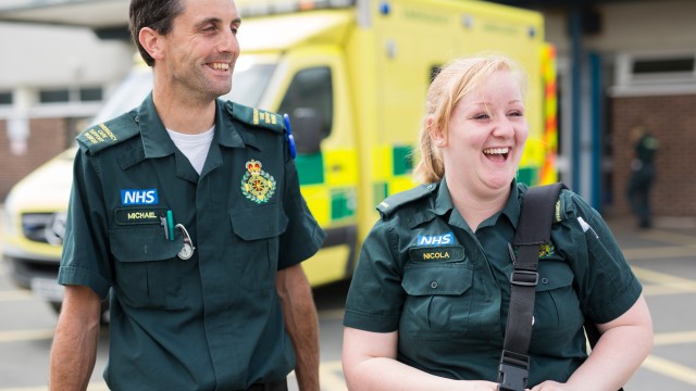 Paramedic student walking next to qualified paramedic