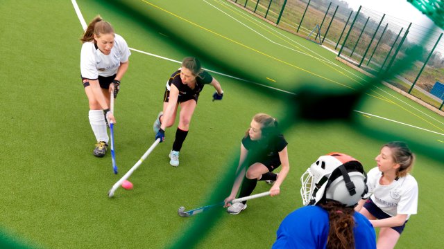 Students playing hockey