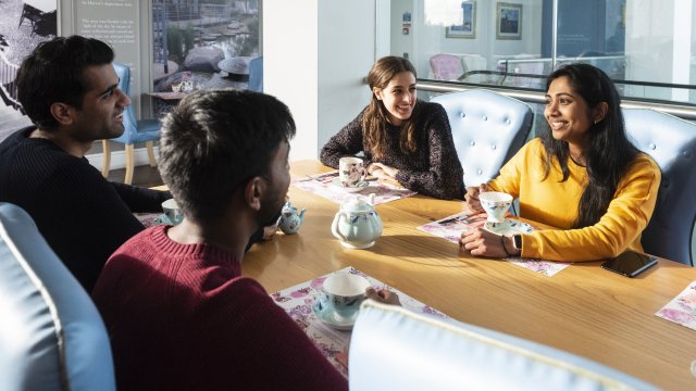 Students chatting around a table