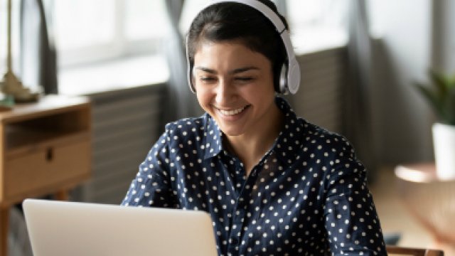 female student looking at her laptop screen