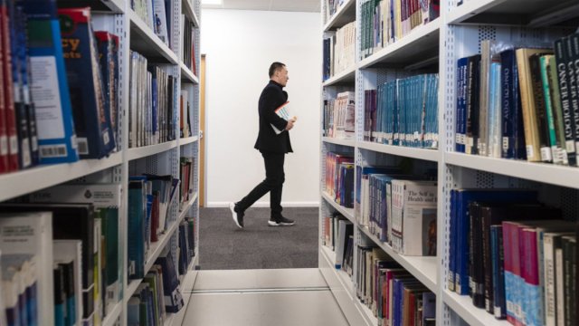 Student walking in library