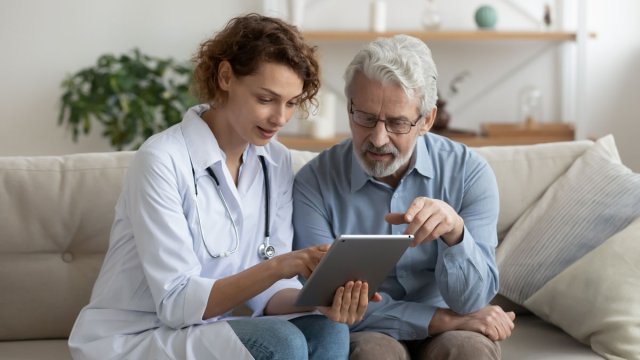 Doctor making a home visit to a patient