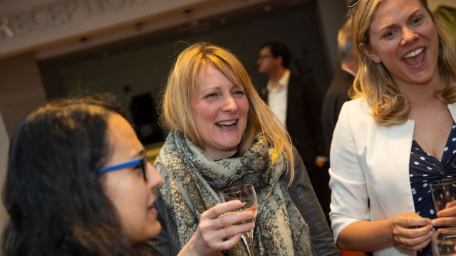 Women laughing at socialising event after Roland Clift lecture by Joanna Yarrow