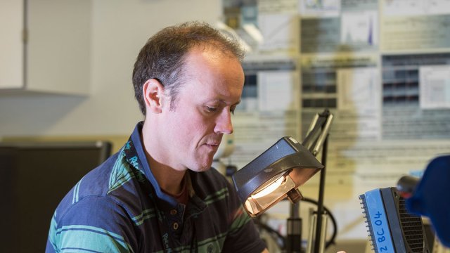 Man using physics equipment