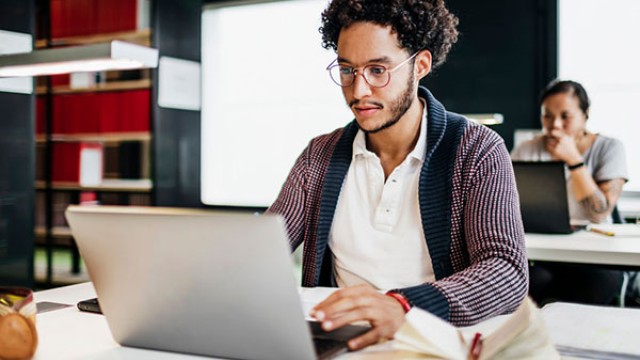 Man sat working on laptop