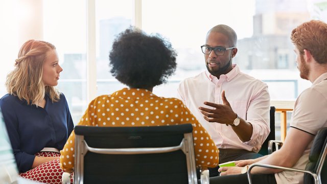 Group of people talking in an office