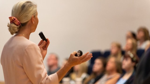 Speaker presents in lecture hall