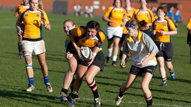Girls team playing Rugby at the Surrey Sports Park