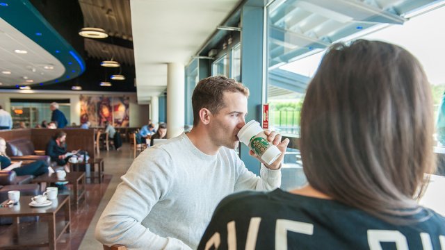 People having a drink in Starbucks in the Surrey Sports Park