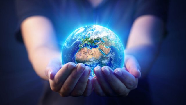 Person holding world in their hands