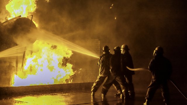 Firefighters extinguishing an industrial fire