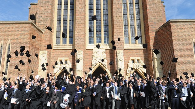 Graduates throwing caps in the air