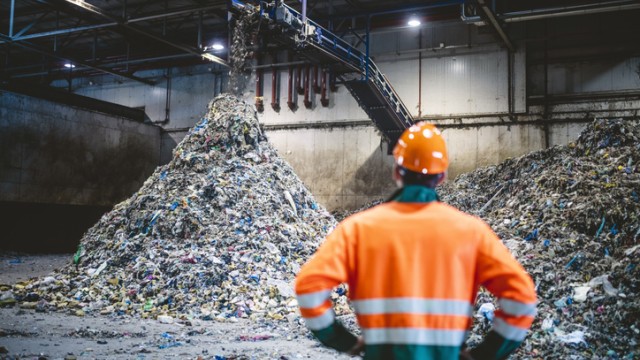 Construction worker looking at a pile