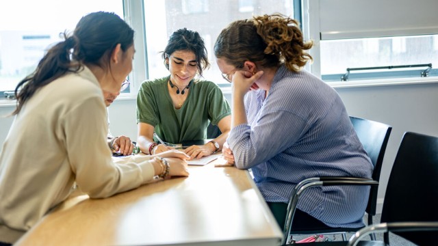 Students collaborating at a table