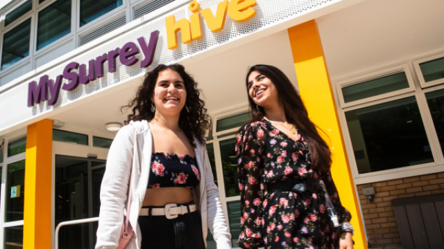 Two students outside of the MySurrey Hive