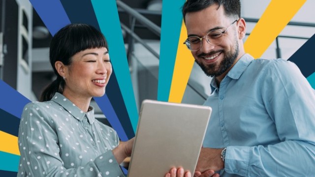 Two students looking at a tablet