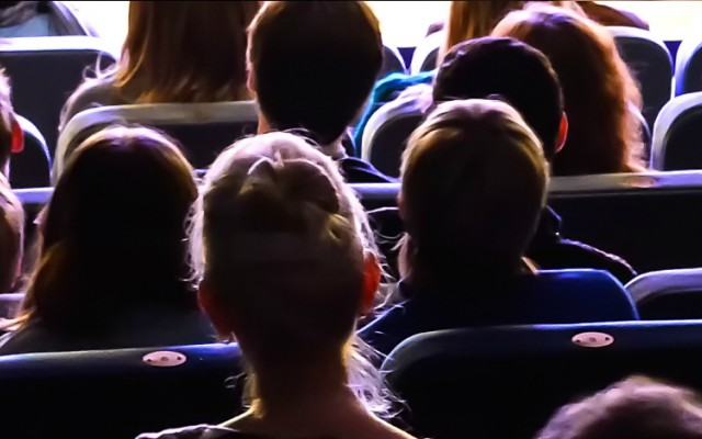 Back of audience watching stage
