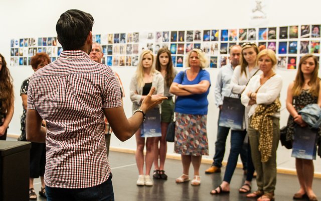 Lecturer talking to visitors