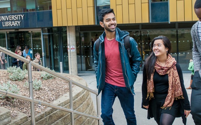 3 students outside the Library and Learning Centre