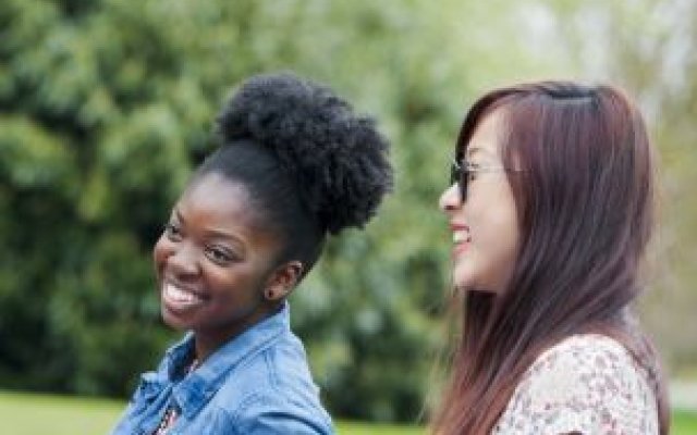 Students laughing grass 