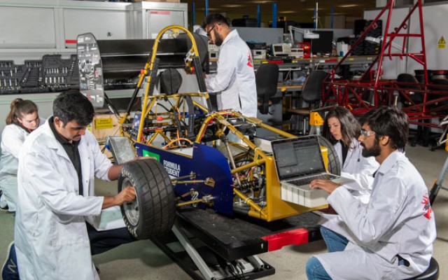 Students working on a race car