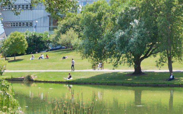 University campus by the lake with the Duke of Kent building in the background