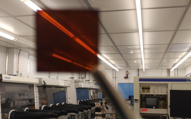 solar cell held up in lab