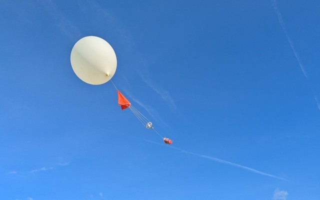 Giant balloon flying into the atmosphere 