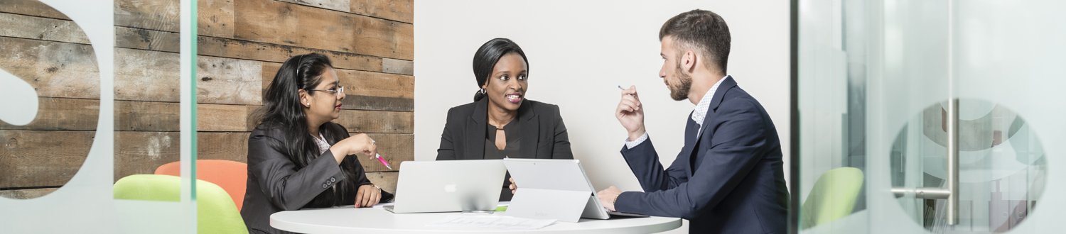 Three people in a meeting