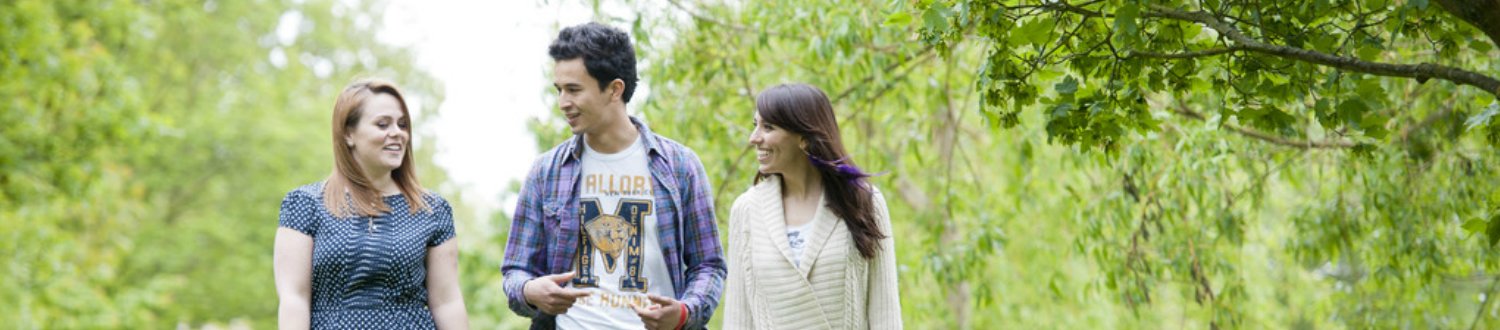 Three students walking outside