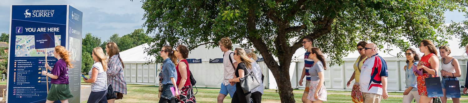 Students touring campus with helper
