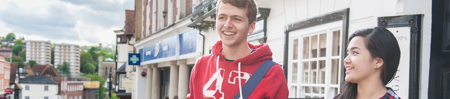 Male and female student in Guildford