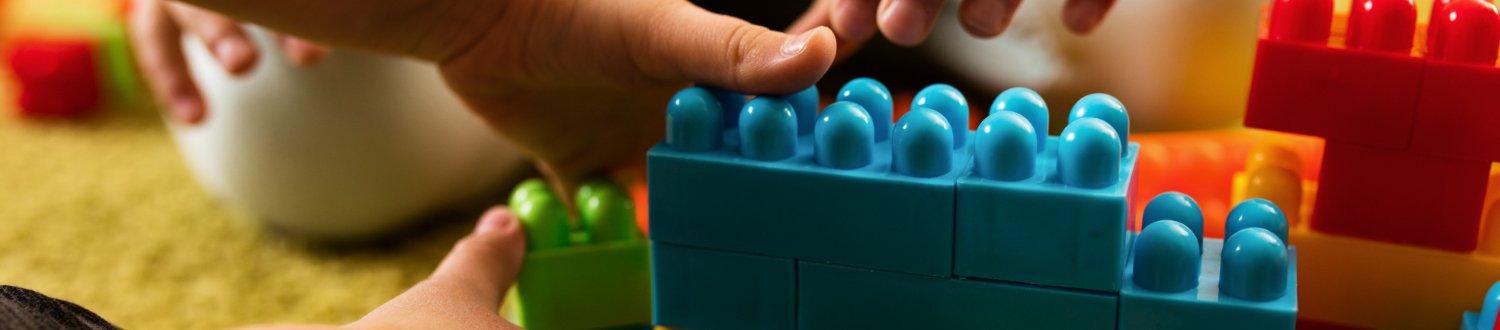Children playing with coloured toys