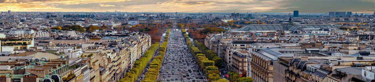 Busy Paris street at sunset