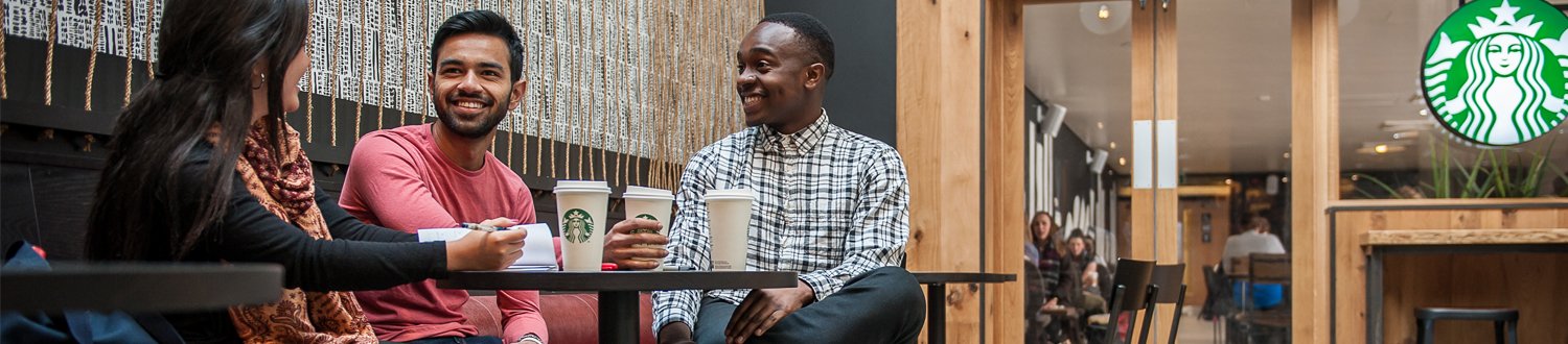 Students talking over coffee in starbucks